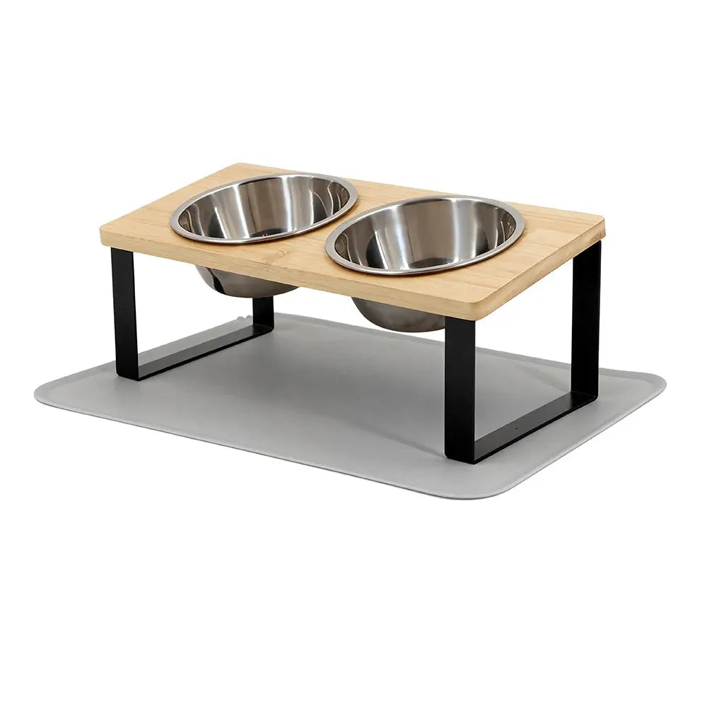 Elevated dog feeder with two stainless steel bowls on wooden tray and black legs, ideal for pet feeding