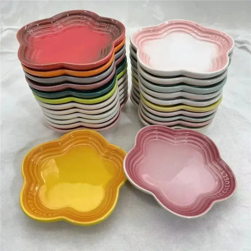 Colorful flower-shaped ceramic pet bowls in assorted hues for dogs and cats