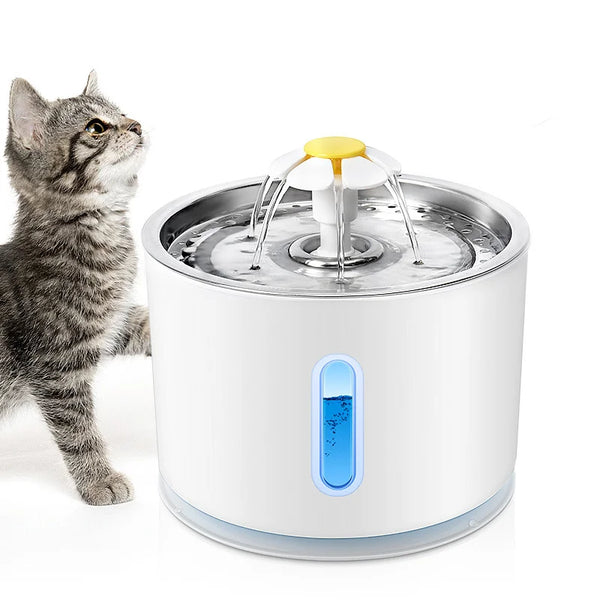 Cat drinking from automatic pet water fountain with flower-shaped spout and water level indicator